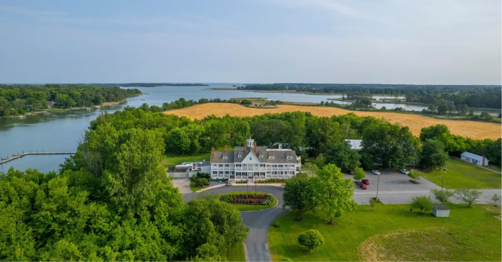 Kent_Island_Resort_with_Manor_House_and_almost_2_miles_of_waterfront Aerial view of Kent Island Resort showing the historic manor house surrounded by nearly two miles of waterfront on Thompson Creek leading to the Chesapeake Bay
