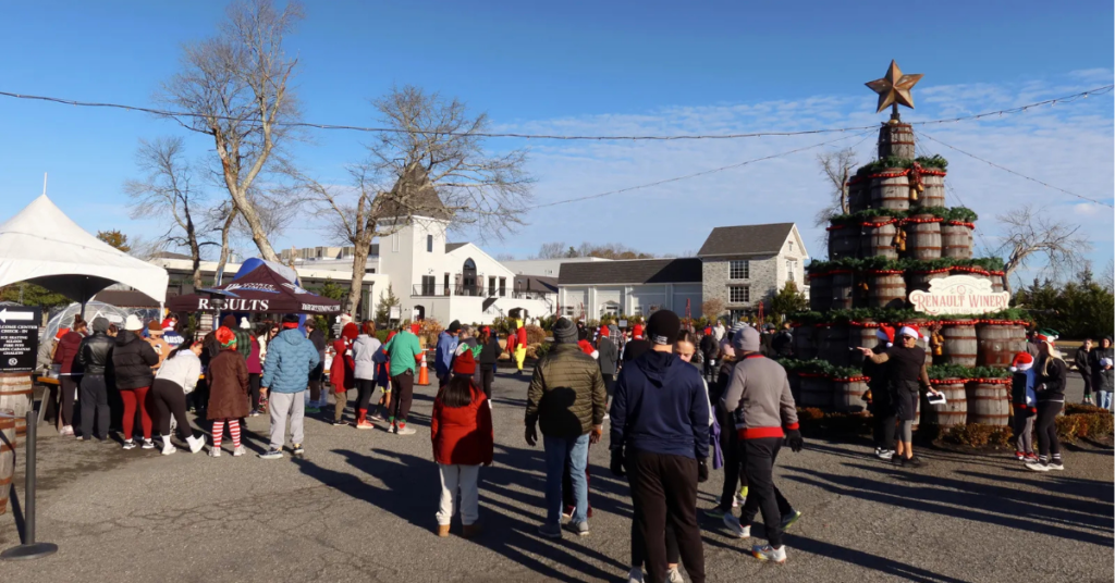 Rendeer_Run_5k_Ticketed_Event_at_Renault_Winery_Resort.jpg Large crowd of participants at the Reindeer Run 5K ticketed event at Renault Winery Resort with the property and branded barrel Christmas tree visible in background
