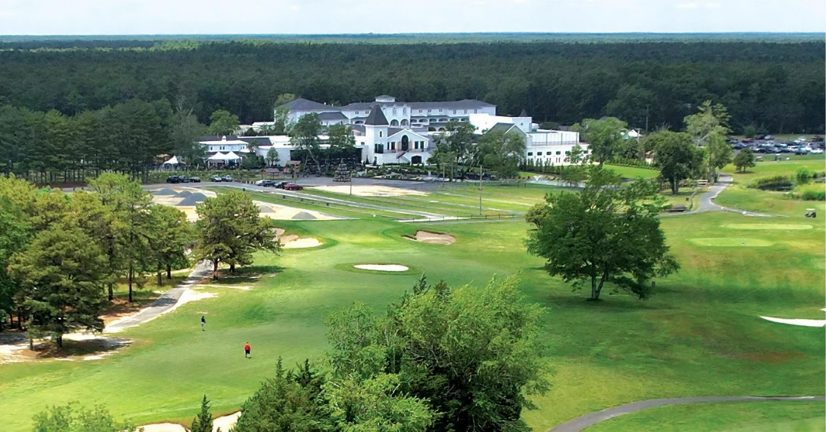 aerial-vineyard-national-renault-winery-resort-chateau-background.jpg Aerial view of Vineyard National golf course at Renault Winery Resort with the main resort and Chateau Renault in the background, illustrating the multi-revenue-stream model that defines the best alternative investments for accredited investors.
