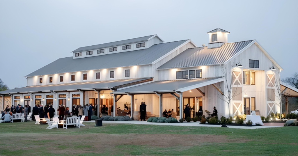 Kent_Island_Resort_Farmstead_with_Outdoor_Event.jpg The Farmstead event venue at Kent Island Resort, Stevensville, Maryland, with guests gathered for a large-scale outdoor event at dusk, illustrating the operational complexity of contractual event execution at a destination resort