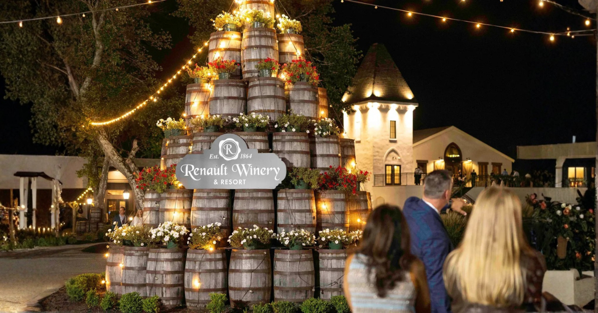 Evening scene at Renault Winery Resort with guests gathered near the barrel display and string lights in Egg Harbor City, New Jersey
