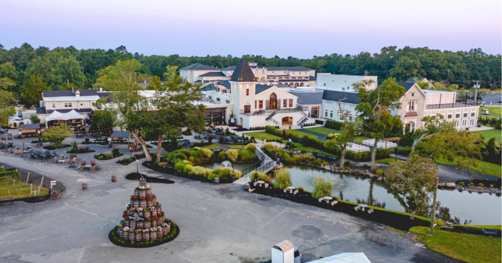 renault-winery-resort-aerial.jpg Aerial view of Renault Winery Resort campus and grounds in Egg Harbor City, New Jersey at dusk (experiential hospitality asset class guide)